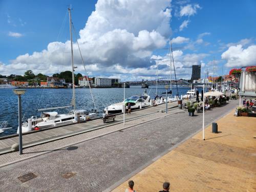 a marina with boats parked in the water at Grannys Harbour View - 1st floor in Sønderborg