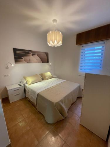 En eller flere senge i et værelse på Finisterre Fisterra apartamento en la playa