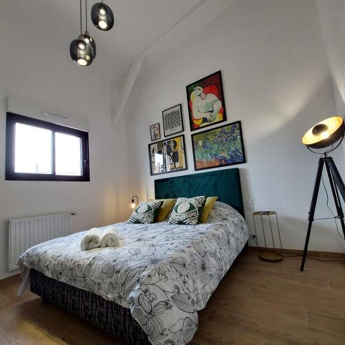 a bedroom with a bed in a room at Résidence Tamaris Loft House in La Mézière