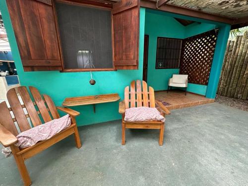 two chairs and a table on a patio at Mono Azul Cahuita in Cahuita