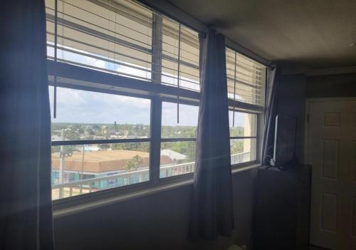 a window in a room with a view of a building at Sea Dip Resort Studios! in Daytona Beach