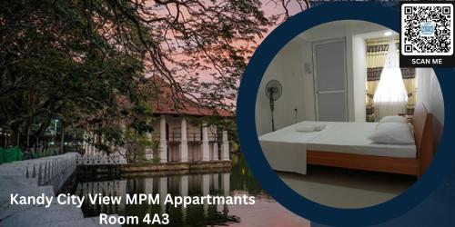 a picture of a bedroom with a bed next to the water at CITY VIEW KANDY - MPM APARTMENT 4A in Kandy