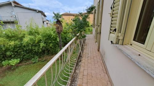 a balcony with a walkway next to a house at Villa Tessa in Ronciglione