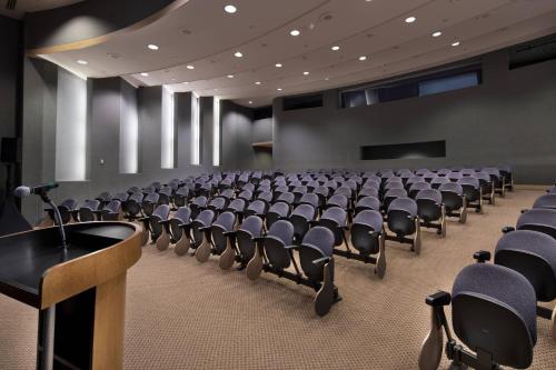 a conference room with chairs and a podium in it at Westfields Marriott Washington Dulles in Chantilly