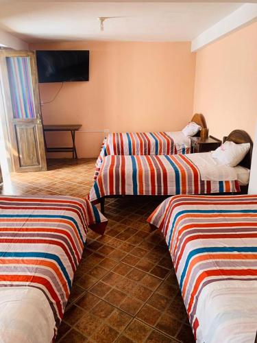 Cama o camas de una habitación en Fidelísima Hotel