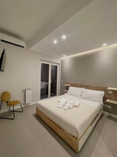 Ліжко або ліжка в номері Appartamento al Mare Sant’Agata