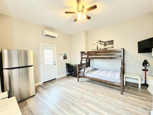 a room with a bunk bed and a refrigerator at Great Studio Apartment by Universities in Philadelphia