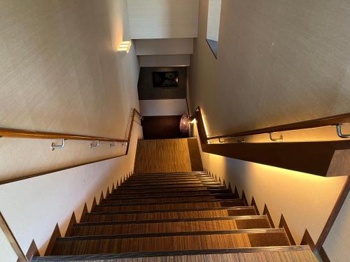 a set of stairs in a building at Spa and Esthetique Suichokan-Female&Adult Only in Jozankei