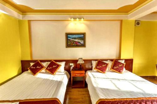 Postel nebo postele na pokoji v ubytování Cherry Hotel