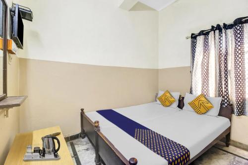 Postelja oz. postelje v sobi nastanitve SPOT ON Bhavani Rest Rooms