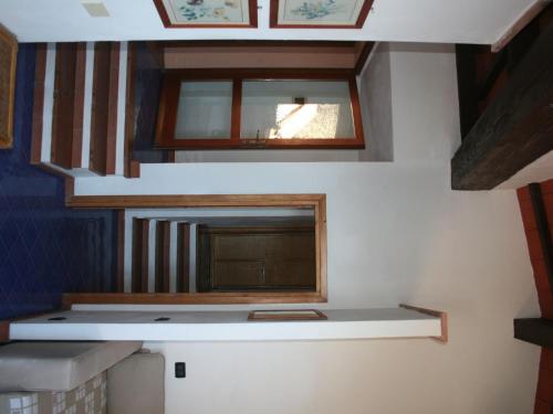 a small room with a mirror and a window at Quinta holiday residence in Rio nell'Elba in Rio nellʼElba