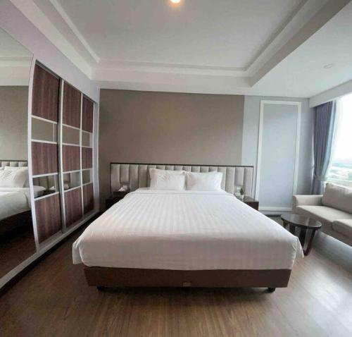 Ένα ή περισσότερα κρεβάτια σε δωμάτιο στο Panbil Residence Apartment Batam