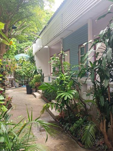 a house with a lot of plants in front of it at Adrian View resort in Ko Si Chang