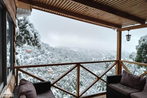 a room with a view of a snow covered mountain at Cabaña Andes in El Canelo