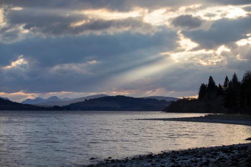 a view of a body of water with a cloudy sky at MacGregor in Pitlochry