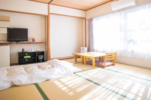 熊野の宿海ひかり　別館 객실 침대