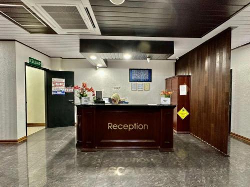 a reception desk in a building with a reception counter at Kangar Hotel Sdn Bhd in Kangar