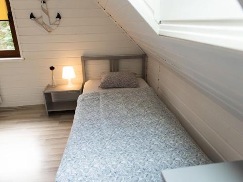 Ένα ή περισσότερα κρεβάτια σε δωμάτιο στο Holiday Home in Kopalino near Baltic Coast