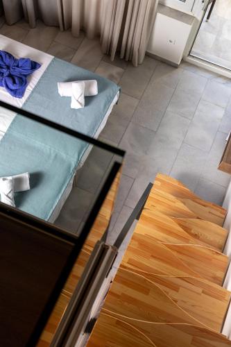 a glass table in a room with a bed and a glass floor at Kostakis Beach in Gerani Chanion