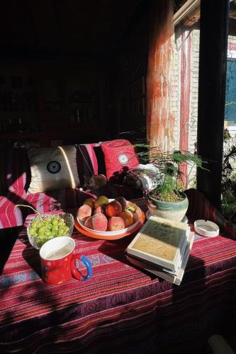 a table with plates of food on a table at Kevin's Trekker Inn in Shangri-La