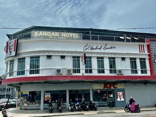 a hotel with motorcycles parked in front of it at Kangar Hotel Sdn Bhd in Kangar