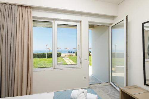 a room with a view of the ocean at Kostakis Beach in Gerani Chanion
