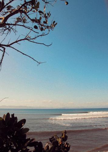 a view of the ocean from the beach at Kurni's Cabin in Sapit
