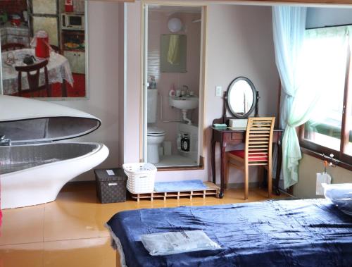 a bathroom with a sink and a mirror at Pension Alba - Vacation STAY 70965v in Tateyama