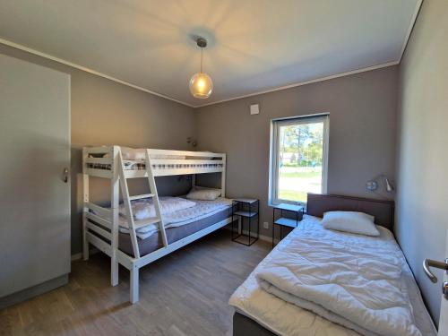 Postel nebo postele na pokoji v ubytování Åminne Fritid & Havsbad AB