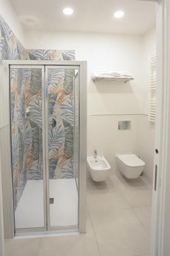 a bathroom with a shower and a toilet at KRIS Apartments in Giardini Naxos