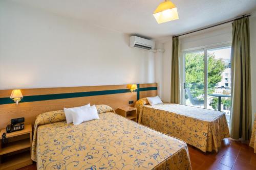 Postel nebo postele na pokoji v ubytování Hotel Bersoca