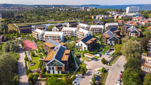 an aerial view of a residential neighbourhood with houses at Flamingo Beach Apartment in Gdańsk