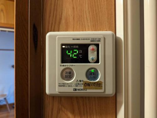 a control panel on a door of a room at 【豊和マンション稲荷302号室】伏見稲荷駅徒歩３分！Free Wifi付のお宿！ in Kyoto