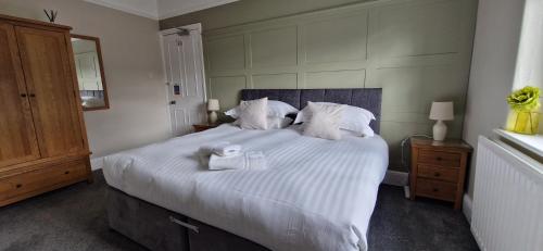 Katil atau katil-katil dalam bilik di Glencoe Guest House