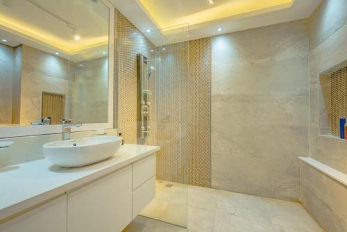 a bathroom with a sink and a shower at Hurghada marina apartment sea view in Hurghada