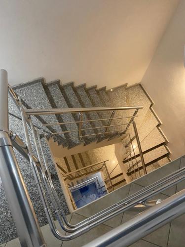 a view from the top of a metal staircase at VIOLCA GUEST HOUSE in Durrës