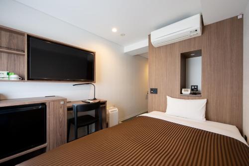 Postel nebo postele na pokoji v ubytování Belmont Hotel