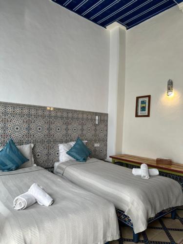 Postel nebo postele na pokoji v ubytování Riad Al Zahia