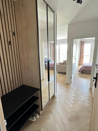 a room with a staircase and a room with a bedroom at Apartament Widokowy Zamkowa in Tczew