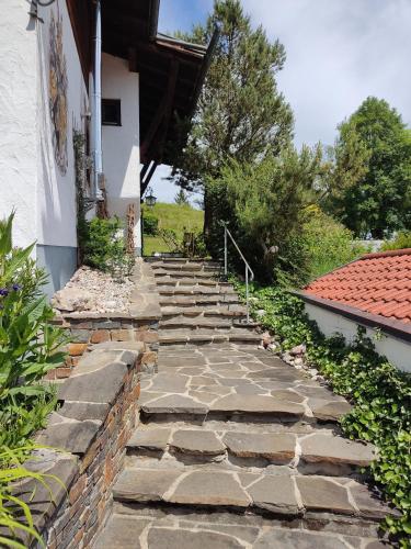 a set of stone steps leading up to a house at Opas Bergchalet in Halblech