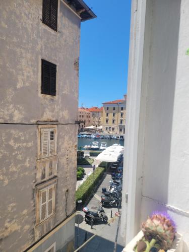 a view of a street from a window of a building at Studio Labirint in Piran