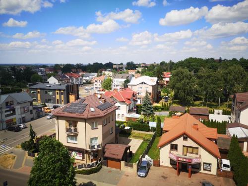 an aerial view of a small town with houses at Małe mieszkanie in Łomża