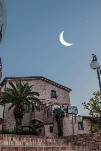 a white frisbee in the sky above a building at Relais Il Mulino in Corigliano Calabro