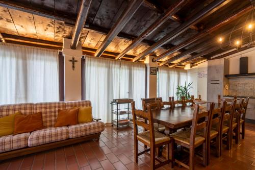 a living room with a table and a couch at Villa Ca' Viola Rimini in Rimini