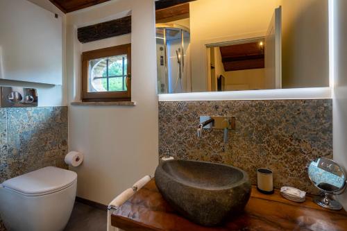 a bathroom with a sink and a toilet at Villa Ca' Viola Rimini in Rimini