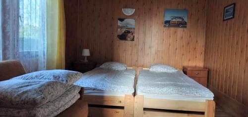 Postel nebo postele na pokoji v ubytování U Marioli