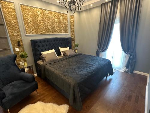 Ένα ή περισσότερα κρεβάτια σε δωμάτιο στο ZeN Luxury Suite