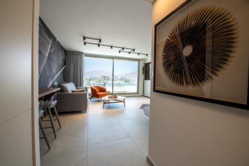 a living room with a view of the ocean at Beach Side-Kings Luxury Sea view Amazing Pool Eilat in Eilat