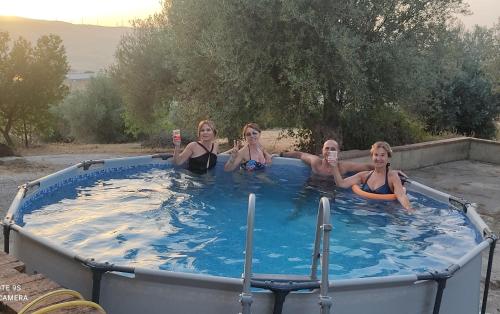 a group of four women in a hot tub at Casa vacanze nel cuore della sicilia in Santa Caterina Villarmosa
