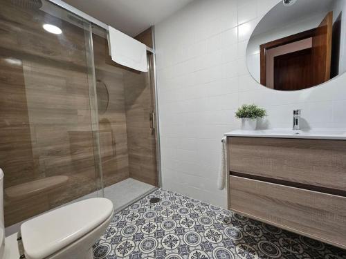 a bathroom with a shower and a toilet and a sink at 633A Colloto, 3 dorm. y garaje in Santa Eulalia